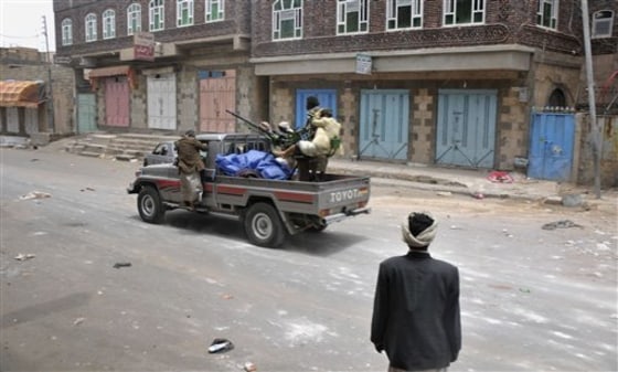 Armed tribesman loyal to Sheik Sadeq al-Ahmar, the head of the powerful Hashid tribe, patrol his house in Sanaa, Yemen, on Saturday.